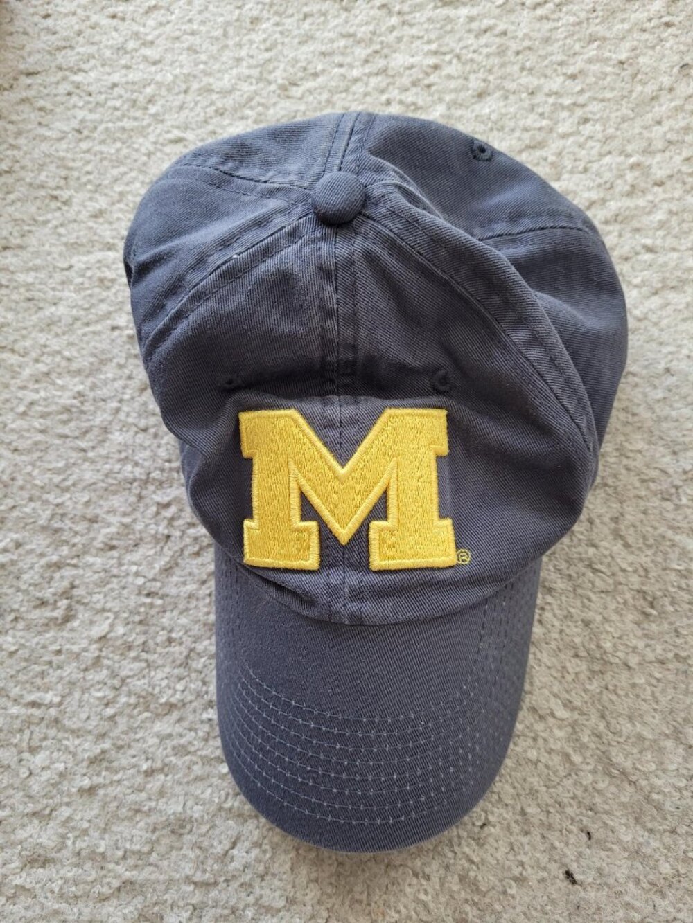 Like-new Michigan Wolverines cotton cap with maize Block M, metal clasp in back.